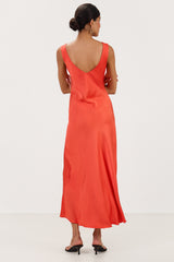 Back view of bright coral satin slip dress
